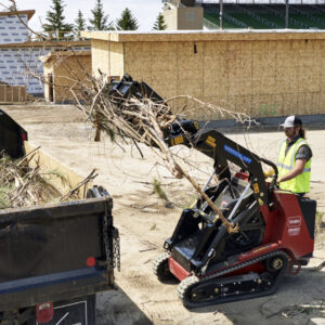 Mini skid steer rental with grapple for moving brush and logs