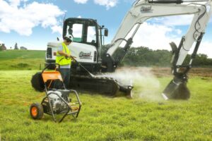 Cleaning excavator with pressure washer rental